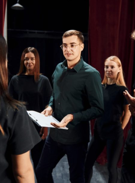 group-of-actors-in-dark-colored-clothes-on-rehears-YB2KLTN.jpg